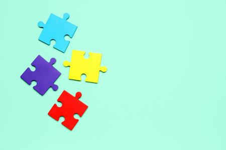 Puzzle pieces on green background. World Autism Awareness Dayの写真素材
