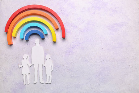 Family figure with blocks on grunge background. World Autism Awareness Dayの写真素材