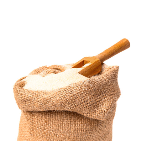 Sack bag with raw semolina on white background, closeupの写真素材