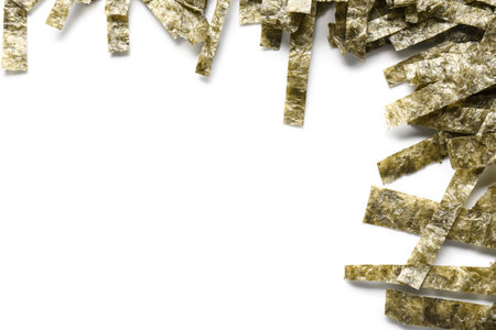 Cut nori sheets isolated on white background, closeupの写真素材