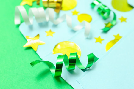 Composition with envelope and confetti on green backgroundの写真素材