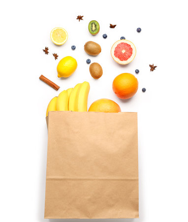 Paper bag with fruits on white backgroundの写真素材