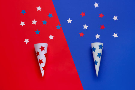 Frame made of party cones with stars on color backgroundの写真素材