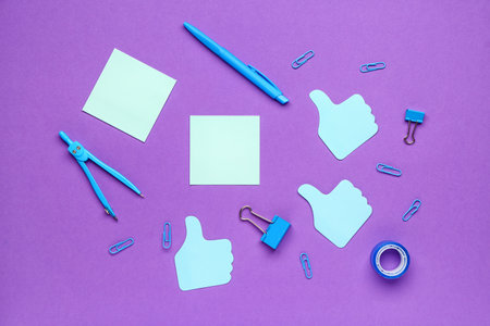 Sticky notes and stationery on purple backgroundの写真素材