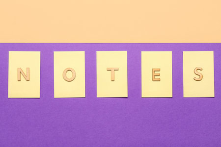 Word NOTES and sticky papers on color backgroundの写真素材