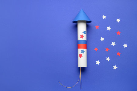 Firework rocket with stars for Independence Day on blue backgroundの写真素材