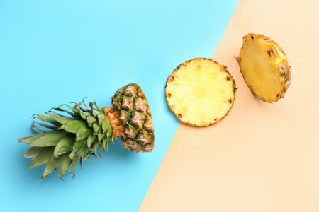Fresh cut pineapple on color backgroundの写真素材