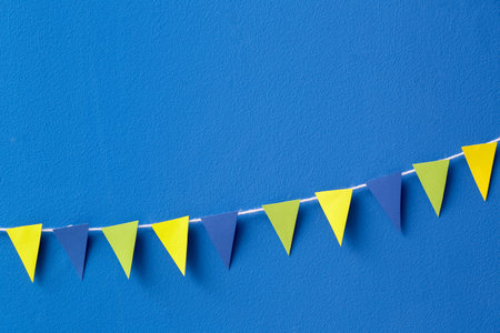 Colorful flags for Festa Junina on blue backgroundの写真素材