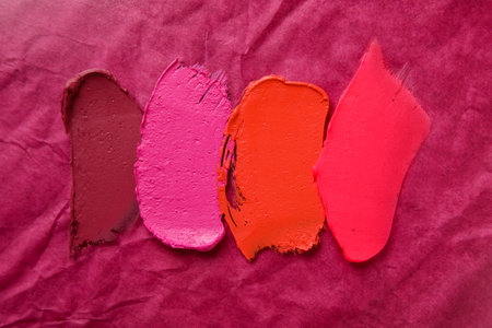 Different lipstick strokes on color backgroundの写真素材