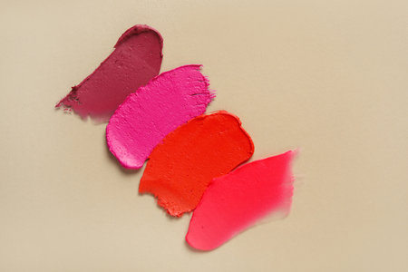 Different lipstick strokes on beige backgroundの写真素材