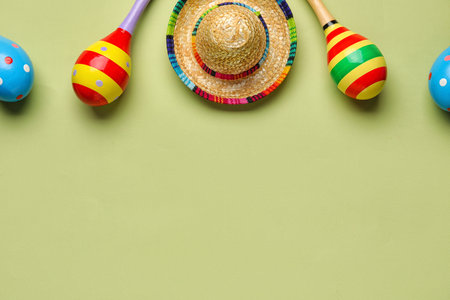 Mexican maracas with sombrero hat on green backgroundの写真素材