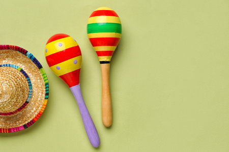 Mexican maracas with sombrero hat on green backgroundの写真素材