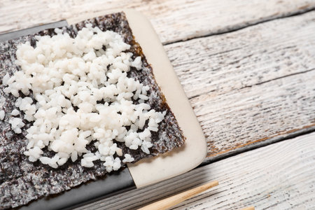 Nori with rice on light wooden background, closeupの写真素材