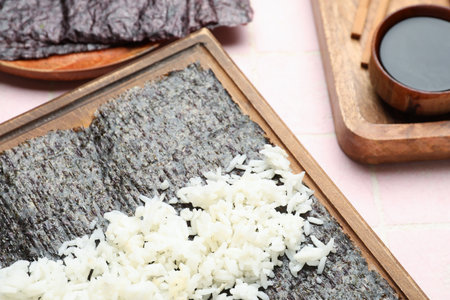 Wooden board of nori with rice on table, closeupの写真素材