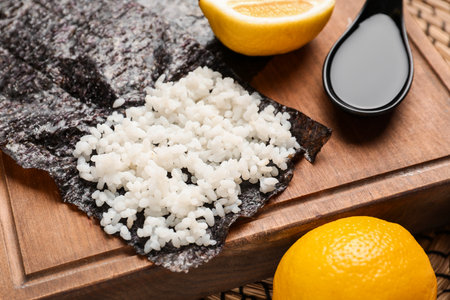 Wooden board of nori with rice on table, closeupの写真素材
