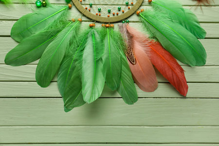 Dream catcher on green wooden background, closeupの写真素材
