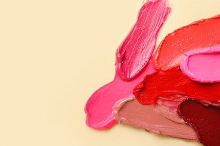 Lipstick strokes on beige backgroundの写真素材