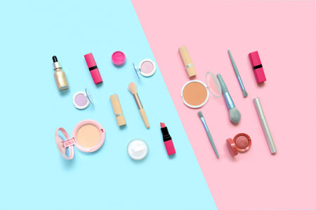 Decorative cosmetics with makeup brushes on blue and pink backgroundの写真素材