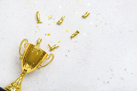 Gold cup with serpentine and stars on light backgroundの写真素材