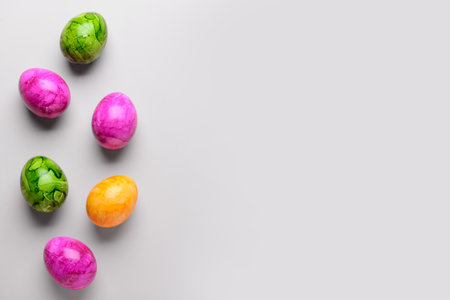 Painted Easter eggs on light backgroundの写真素材