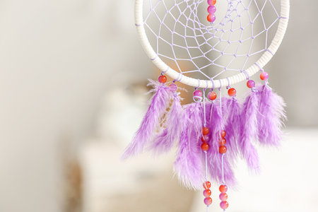 Dream catcher hanging in light bedroom, closeupの写真素材
