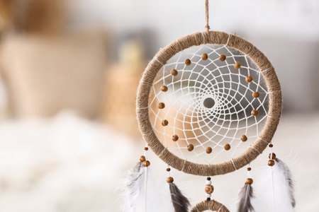 Dream catcher hanging in light room, closeupの写真素材