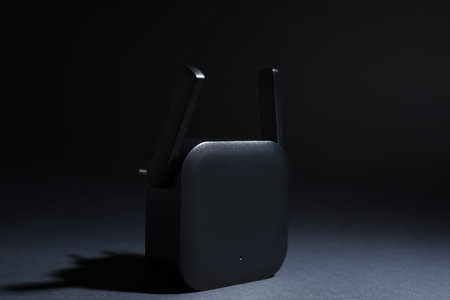 WiFi repeater on black backgroundの写真素材