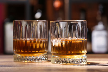 Glasses of cold rum on table in barの写真素材