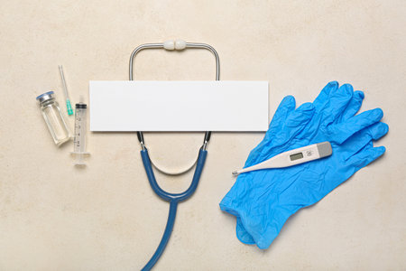 Composition with blank sheet of paper, stethoscope, thermometer, medical gloves and medicines on light background. melanoma conceptの写真素材
