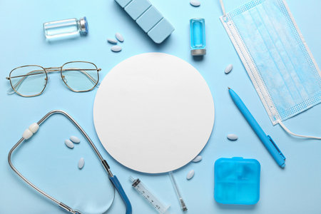 Composition with blank card, medicines, stethoscope and eyeglasses on color background. melanoma conceptの写真素材