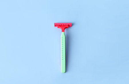 Colorful safety razor on color backgroundの写真素材