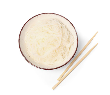 Bowl with tasty rice noodles and chopsticks isolated on white backgroundの写真素材