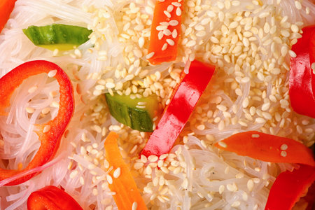 Delicious rice noodles with sesame seeds and vegetables, closeupの写真素材