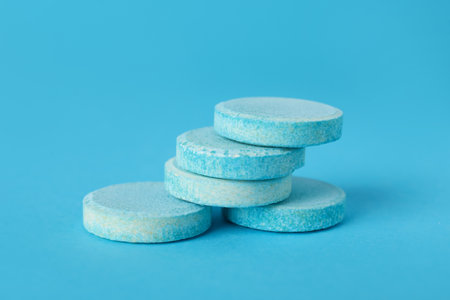 Soluble tablets on blue backgroundの写真素材