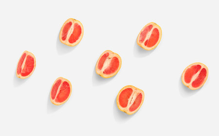 Pieces of ripe grapefruit isolated on white backgroundの写真素材