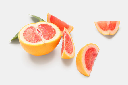 Pieces of ripe grapefruit on white backgroundの写真素材