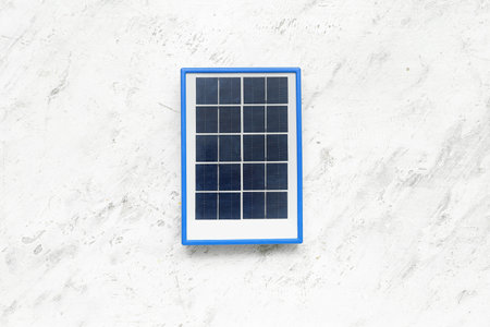 Portable solar panel on white grunge backgroundの写真素材