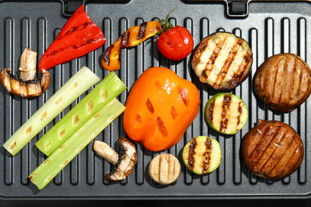 Tasty vegetables on modern electric grillの写真素材
