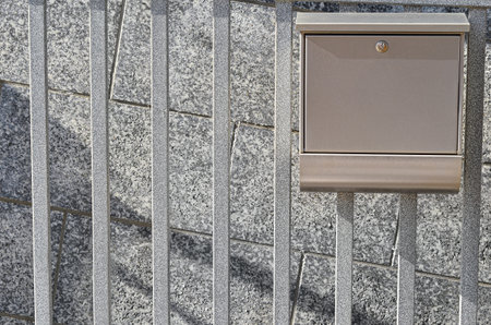 View of mailbox on fence outdoorsの写真素材