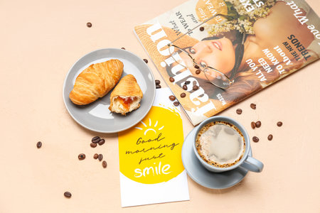 Composition with cup of coffee, croissants, magazine and card on color backgroundの写真素材