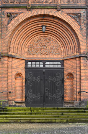 View of old church with wooden doorの写真素材