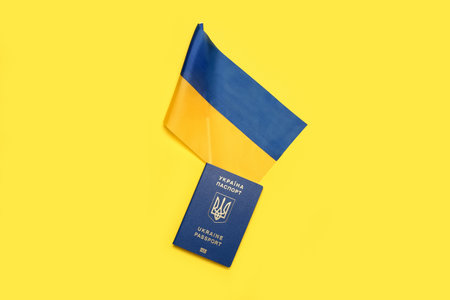 Passport with flag of Ukraine on yellow backgroundの写真素材