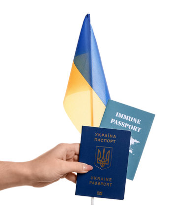 Woman with flag, Ukrainian and immune passports on white backgroundの写真素材