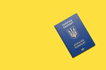 Ukrainian passport on yellow backgroundの写真素材
