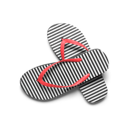 Pair of striped flip-flops on white backgroundの写真素材