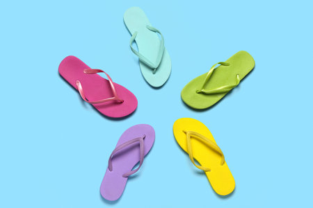 Frame made of colorful flip-flops on blue backgroundの写真素材