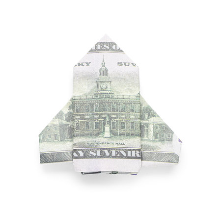Origami space rocket made of dollar banknotes on white backgroundの写真素材