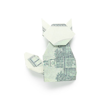 Origami cat made of dollar banknotes on white backgroundの写真素材