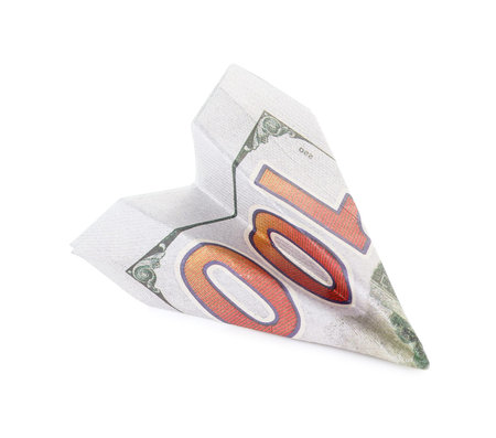 Origami plane made of dollar banknote on white background
