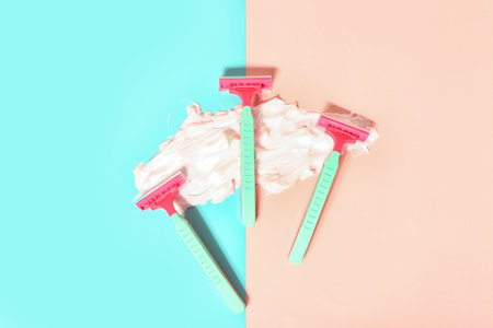Set of safety razors and shaving foam on color backgroundの写真素材